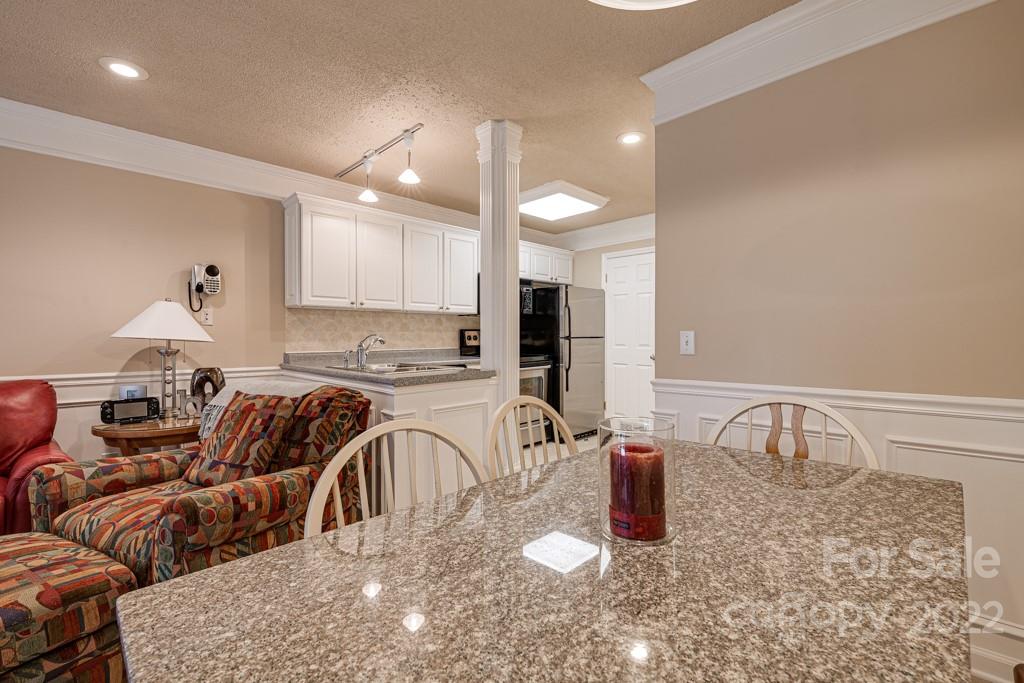 301 Pinnacle Inn Road, Unit 1315 Beech Mountain, NC 28604 - Photo 11 of 47 a kitchen with stainless steel appliances granite countertop a sink and a refrigerator
