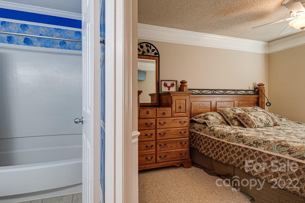 301 Pinnacle Inn Road, Unit 1315 Beech Mountain, NC 28604 - Photo 26 of 47 a bedroom with a bed and a window