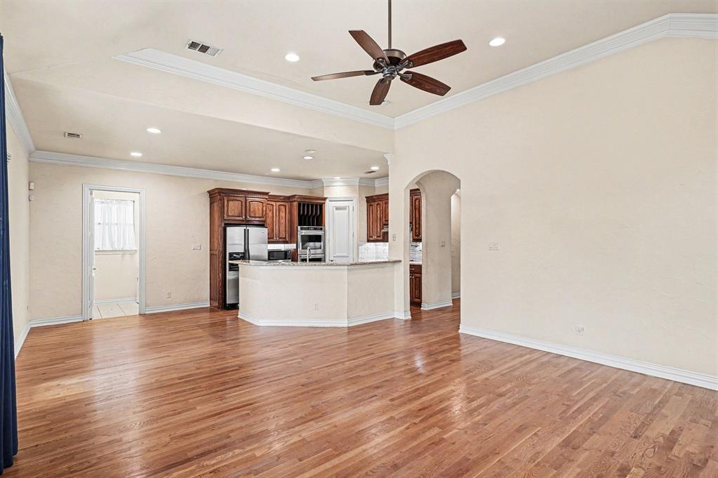 5508 Junius Street Dallas, TX 75214 - Photo 12 of 34 a view of kitchen with stainless steel appliances granite countertop a refrigerator and a stove top oven