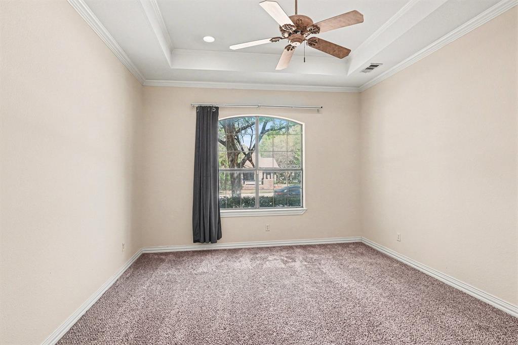 5508 Junius Street Dallas, TX 75214 - Photo 21 of 34 an empty room with a window and a fan