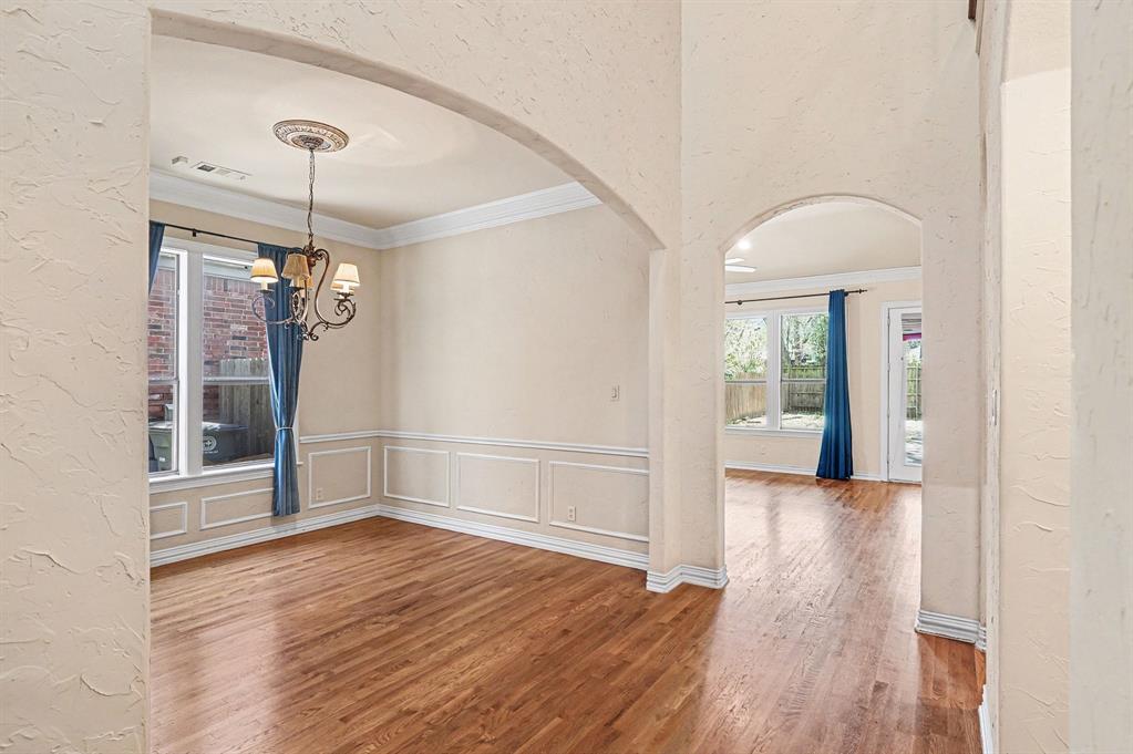 5508 Junius Street Dallas, TX 75214 - Photo 4 of 34 a view of a hallway with wooden floor and entryway