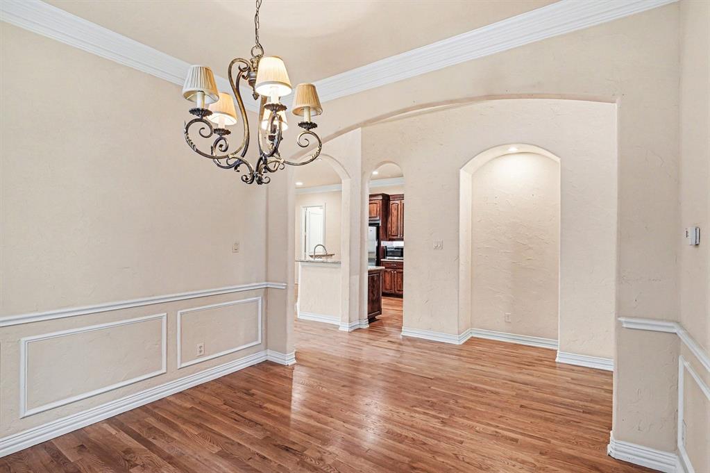 5508 Junius Street Dallas, TX 75214 - Photo 7 of 34 a view of empty room with wooden floor and window
