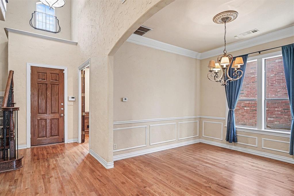 5508 Junius Street Dallas, TX 75214 - Photo 8 of 34 a view of empty room with wooden floor and fan