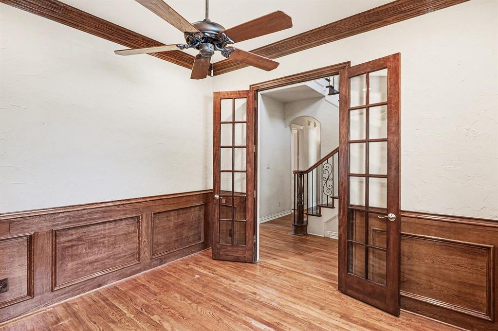 5508 Junius Street Dallas, TX 75214 - Photo 10 of 34 a view of a hallway with wooden floor and staircase