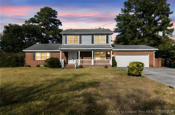 front view of a house with a garden