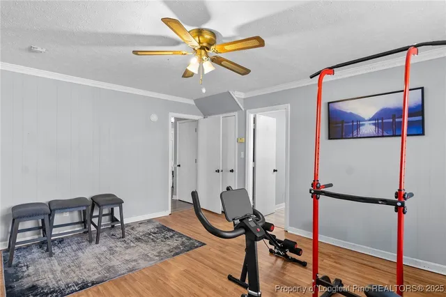 a workspace with wooden floor and a window