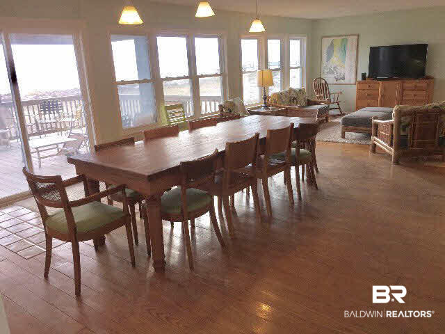 8749 Pompano Way Gulf Shores, AL 36542 - Photo 4 of 45 the cool, classic table is the heart of the action