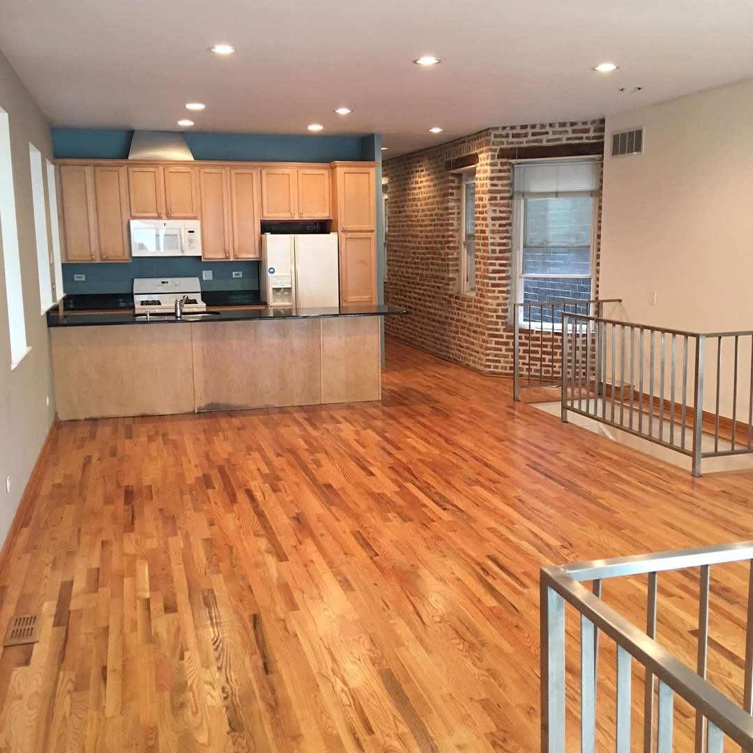 1915 West Huron Street, Unit 2 Chicago, IL 60622 - Photo 12 of 23 a view of kitchen with cabinets and wooden floor