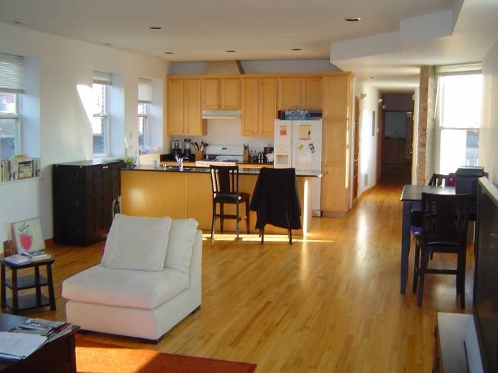 1915 West Huron Street, Unit 2 Chicago, IL 60622 - Photo 23 of 23 a living room with stainless steel appliances furniture and a large window