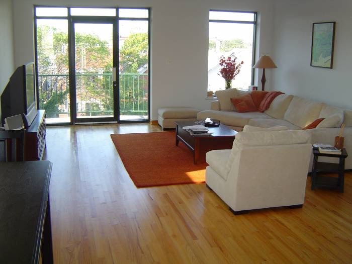 1915 West Huron Street, Unit 2 Chicago, IL 60622 - Photo 3 of 23 a living room with fireplace furniture and a large window