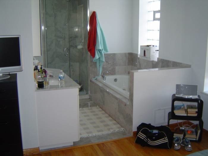 1915 West Huron Street, Unit 2 Chicago, IL 60622 - Photo 5 of 23 a bathroom with a sink and a bathtub