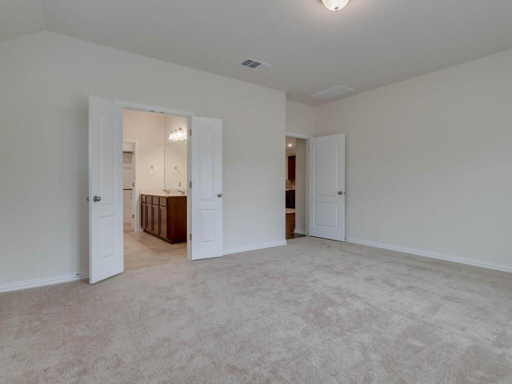 1104 Ridge Runner Drive Georgetown, TX 78628 - Photo 12 of 27 an empty room with kitchen and a yard