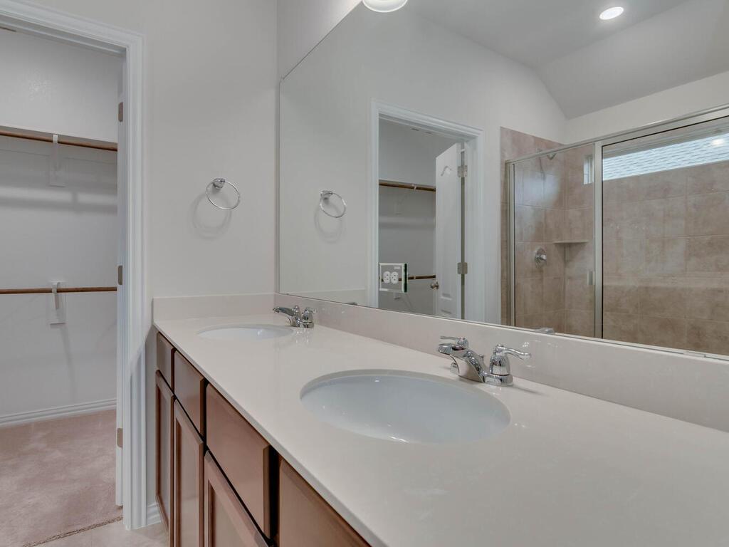 1104 Ridge Runner Drive Georgetown, TX 78628 - Photo 14 of 27 a bathroom with a double vanity sink mirror and double