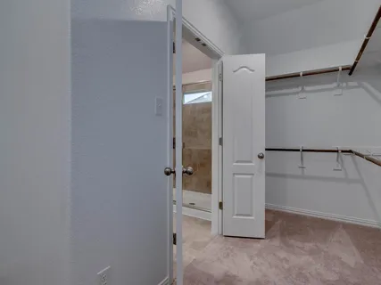 a view of an empty walk in closet