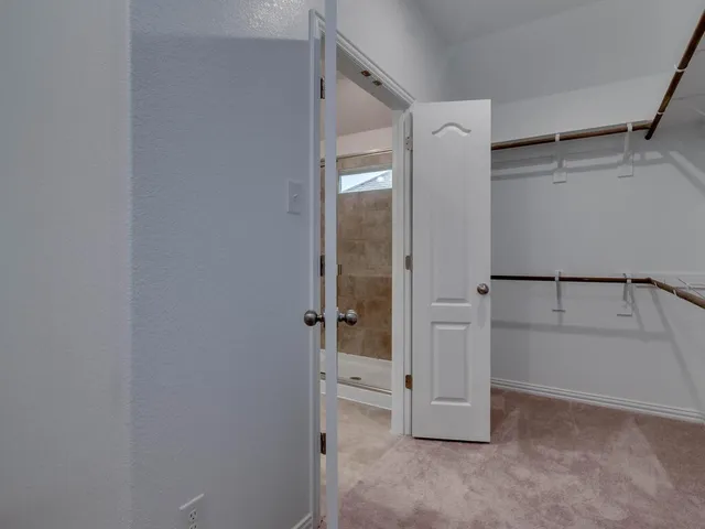 a view of an empty walk in closet