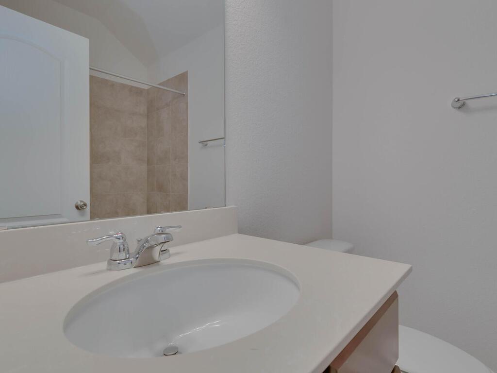 1104 Ridge Runner Drive Georgetown, TX 78628 - Photo 20 of 27 a bathroom with a sink and a mirror