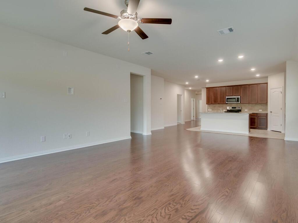 1104 Ridge Runner Drive Georgetown, TX 78628 - Photo 9 of 27 a view of a kitchen with a sink and a stove top oven