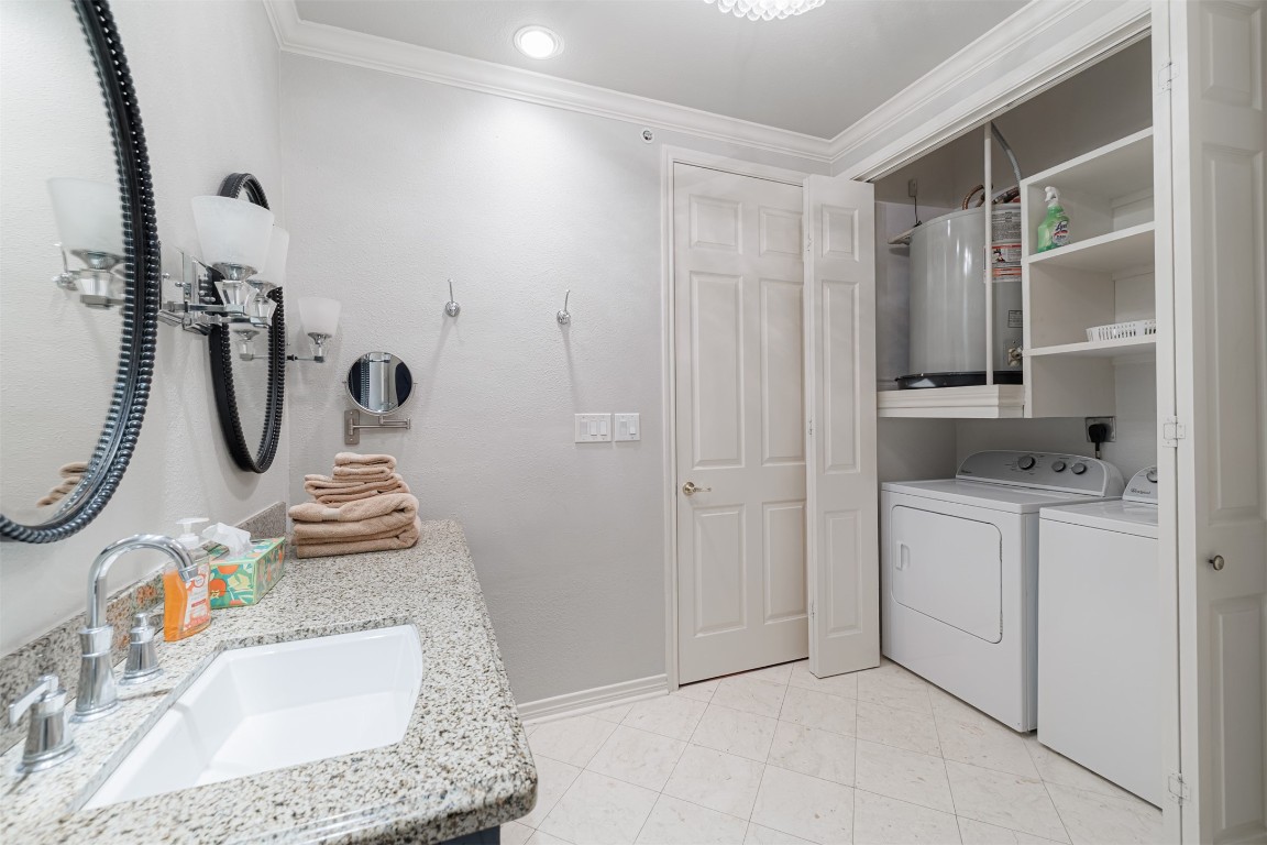 2400 McCue Road, Unit 112 Houston, TX 77056 - Photo 10 of 24 a bathroom with a granite countertop sink and a mirror