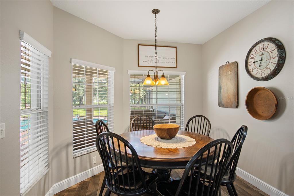 9045 Lake Hatchineha Road Kissimmee, FL 34759 - Photo 22 of 47 a view of a dining room with furniture window and outside view