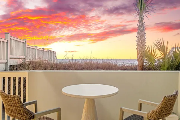 a view of a chairs and table in the terrace