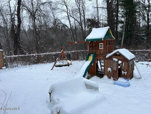 a view of playground slide with seating space