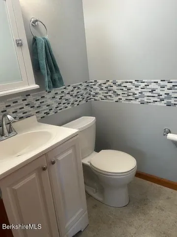 a bathroom with a sink and a toilet