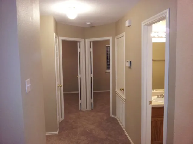 a kitchen with a refrigerator and a sink