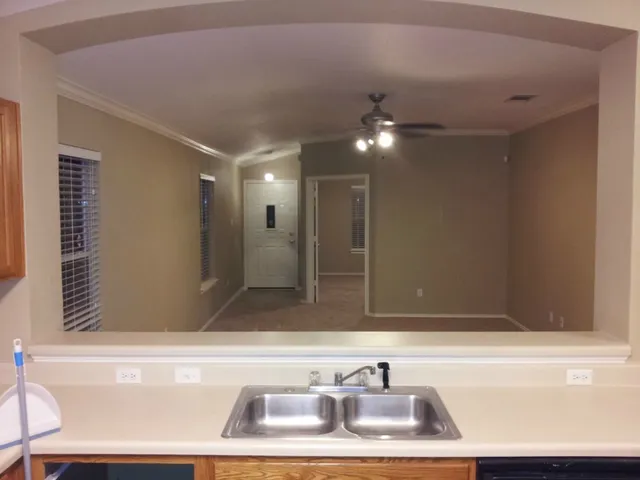 a view of an empty room with a window