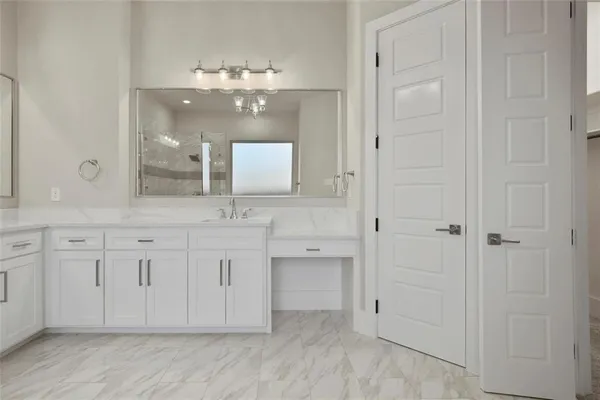 a spacious bathroom with a double vanity sink mirror and double
