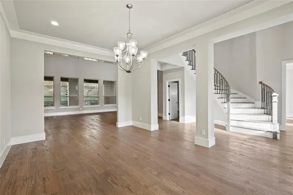 a view of a livingroom with wooden floor and fireplace