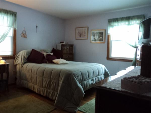 259 Mallowhill Road Springfield, MA 01129 - Photo 7 of 11 a bedroom with a bed and a window