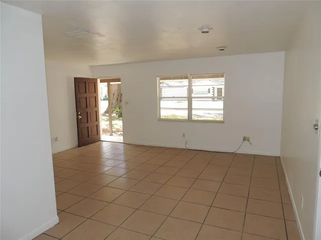 a view of an empty room and window
