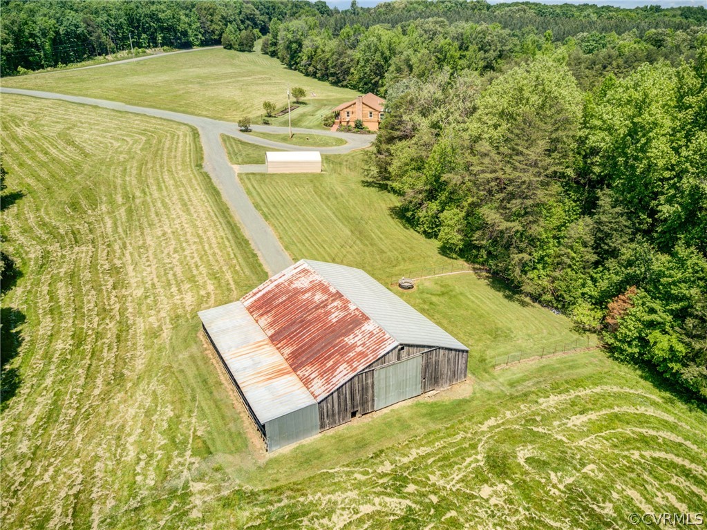 2834 Venable Road Kents Store, VA 23084 - Photo 11 of 47 a view of a swimming pool with a yard
