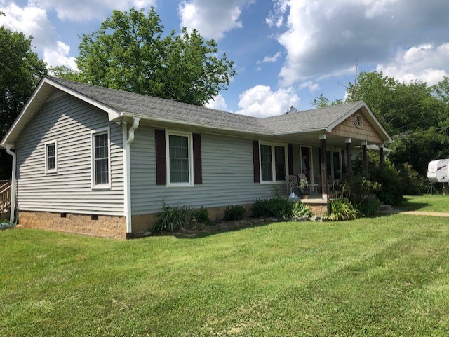 2441 Rally Hill Road Columbia, TN 38401 - Photo 1 of 14 a view of a house with a yard and a garden