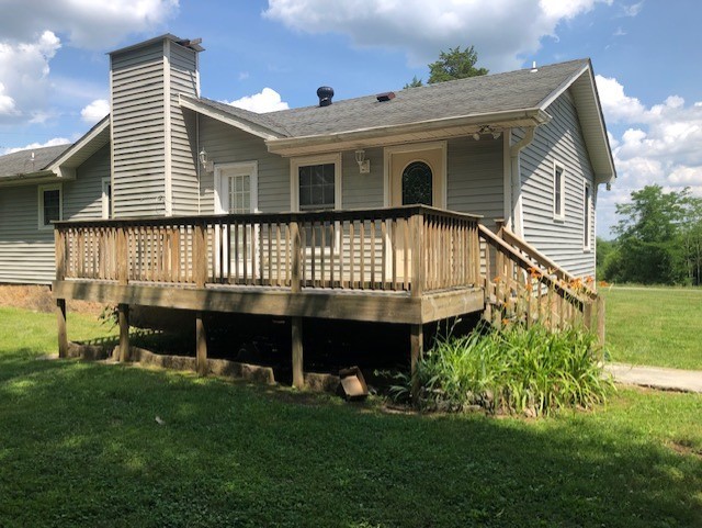 2441 Rally Hill Road Columbia, TN 38401 - Photo 2 of 14 a front view of a house with a garden and deck