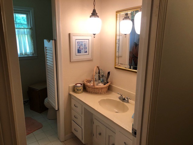 2441 Rally Hill Road Columbia, TN 38401 - Photo 11 of 14 a bathroom with a sink toilet and mirror