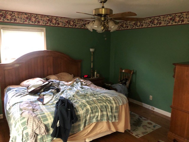 2441 Rally Hill Road Columbia, TN 38401 - Photo 12 of 14 a bed sitting in a bedroom next to a window