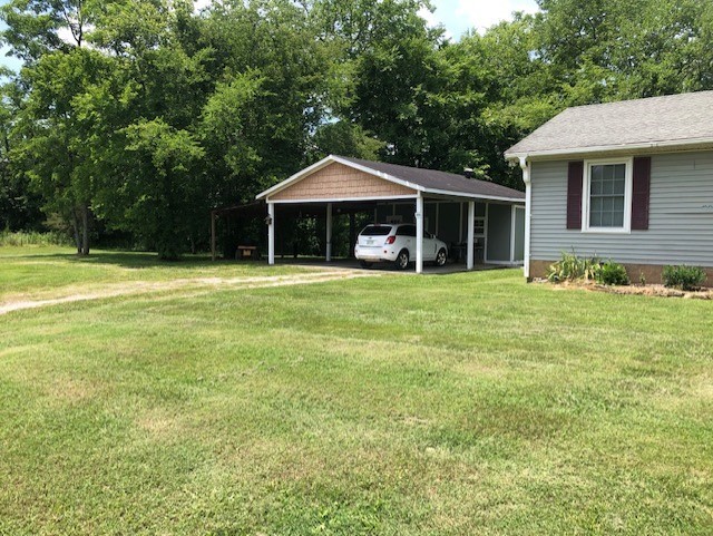 2441 Rally Hill Road Columbia, TN 38401 - Photo 4 of 14 a front view of a house with a yard