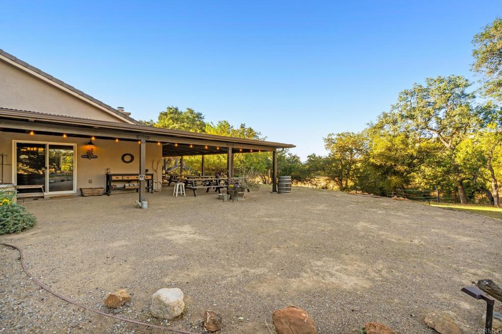 25258 Black Canyon Road Santa Ysabel, CA 92070 - Photo 13 of 71 a view of a house with backyard and sitting area