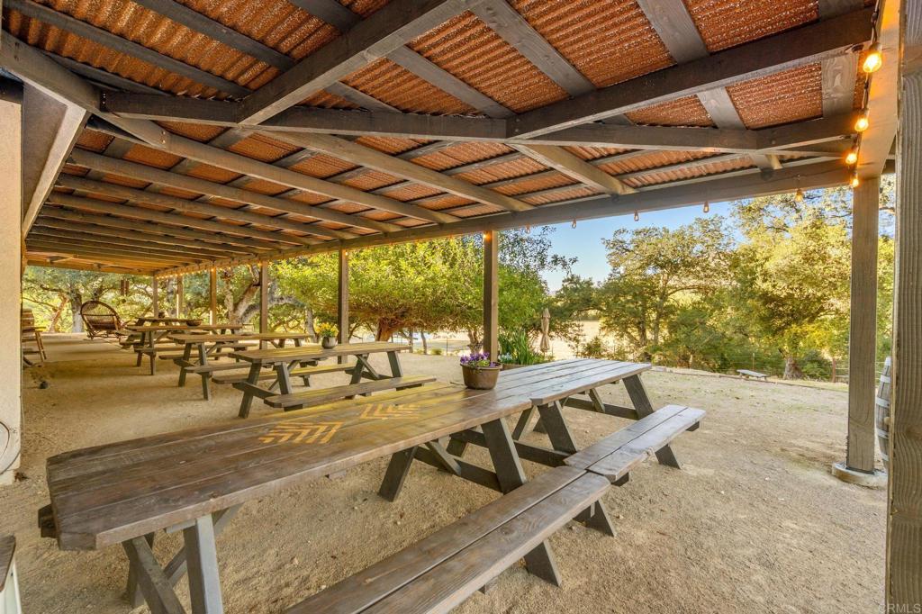 25258 Black Canyon Road Santa Ysabel, CA 92070 - Photo 14 of 71 a view of a swimming pool with outdoor seating
