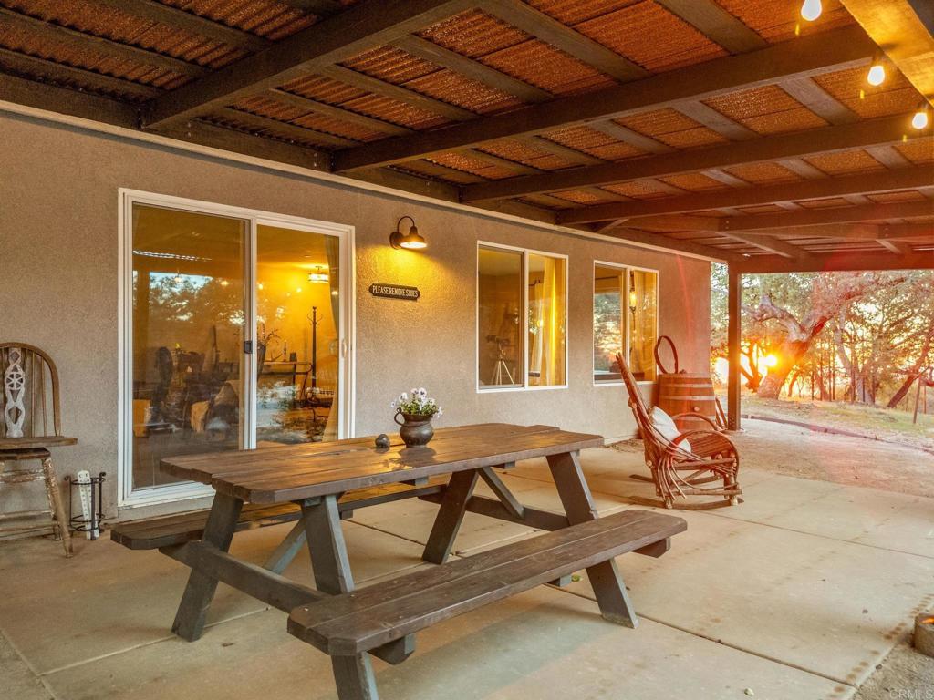 25258 Black Canyon Road Santa Ysabel, CA 92070 - Photo 18 of 71 a patio with table and chairs