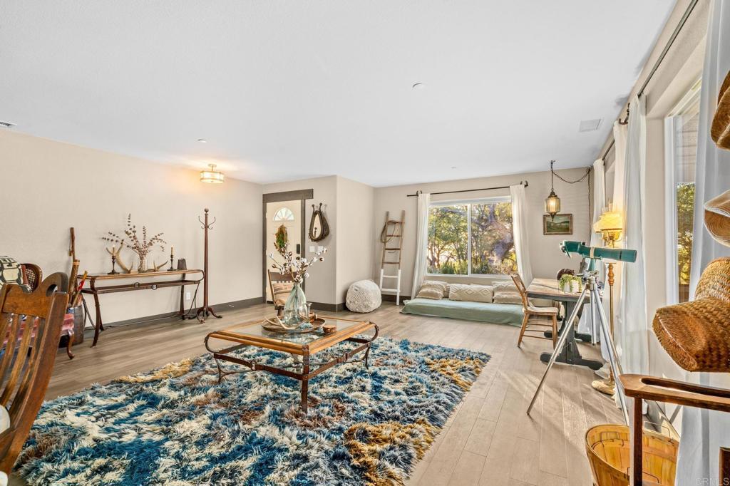 25258 Black Canyon Road Santa Ysabel, CA 92070 - Photo 19 of 69 a living room with furniture and a table