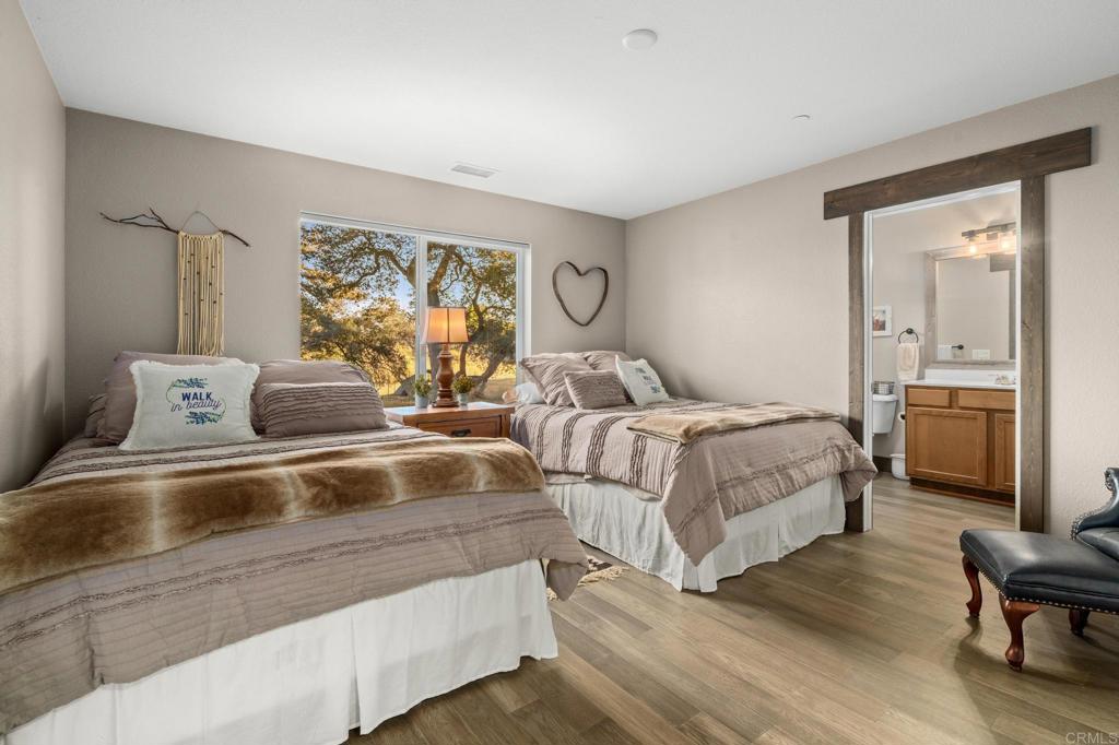 25258 Black Canyon Road Santa Ysabel, CA 92070 - Photo 30 of 71 a bedroom with double bed and a window