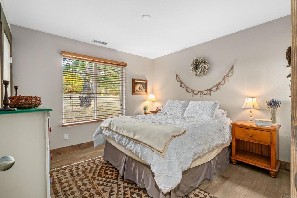 25258 Black Canyon Road Santa Ysabel, CA 92070 - Photo 31 of 69 a bedroom with a bed and a window