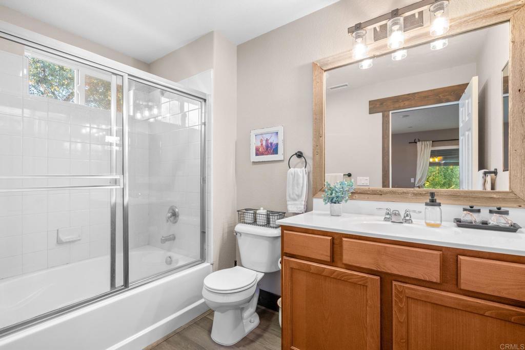 25258 Black Canyon Road Santa Ysabel, CA 92070 - Photo 32 of 71 a bathroom with a sink a toilet and shower