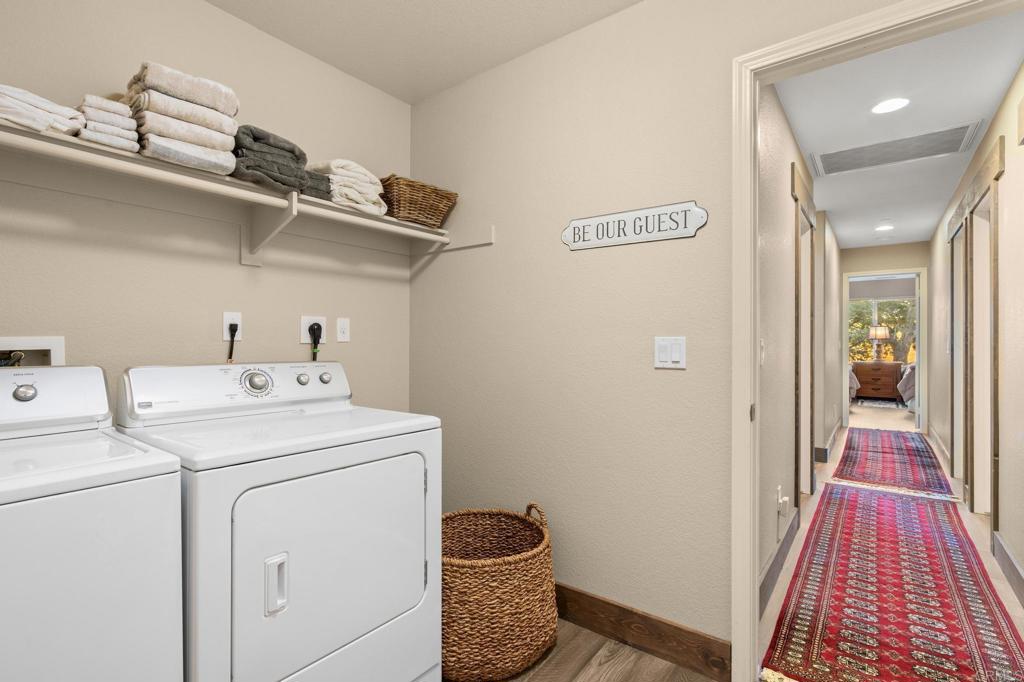 25258 Black Canyon Road Santa Ysabel, CA 92070 - Photo 37 of 71 a hallway with washer and dryer