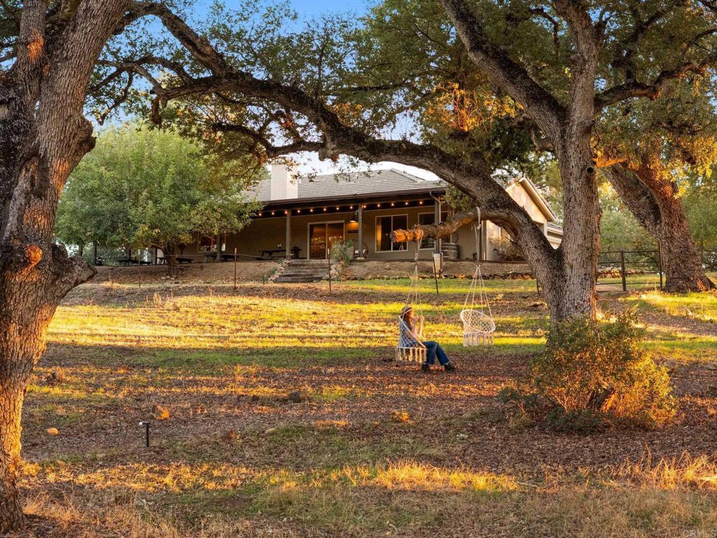 25258 Black Canyon Road Santa Ysabel, CA 92070 - Photo 40 of 69 a view of a swimming pool with a patio