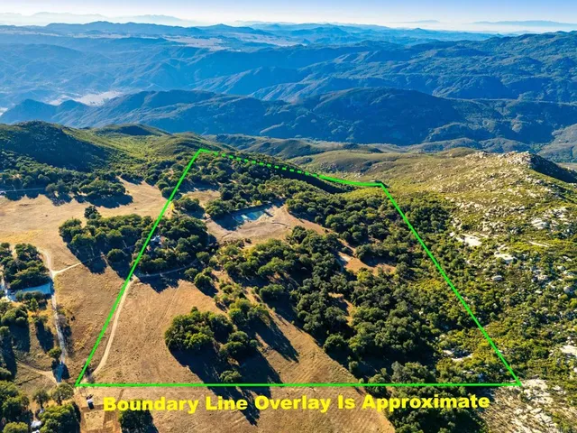 a view of a swimming pool with outdoor seating