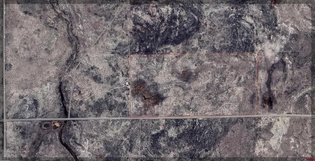 a view of a dry yard from a balcony