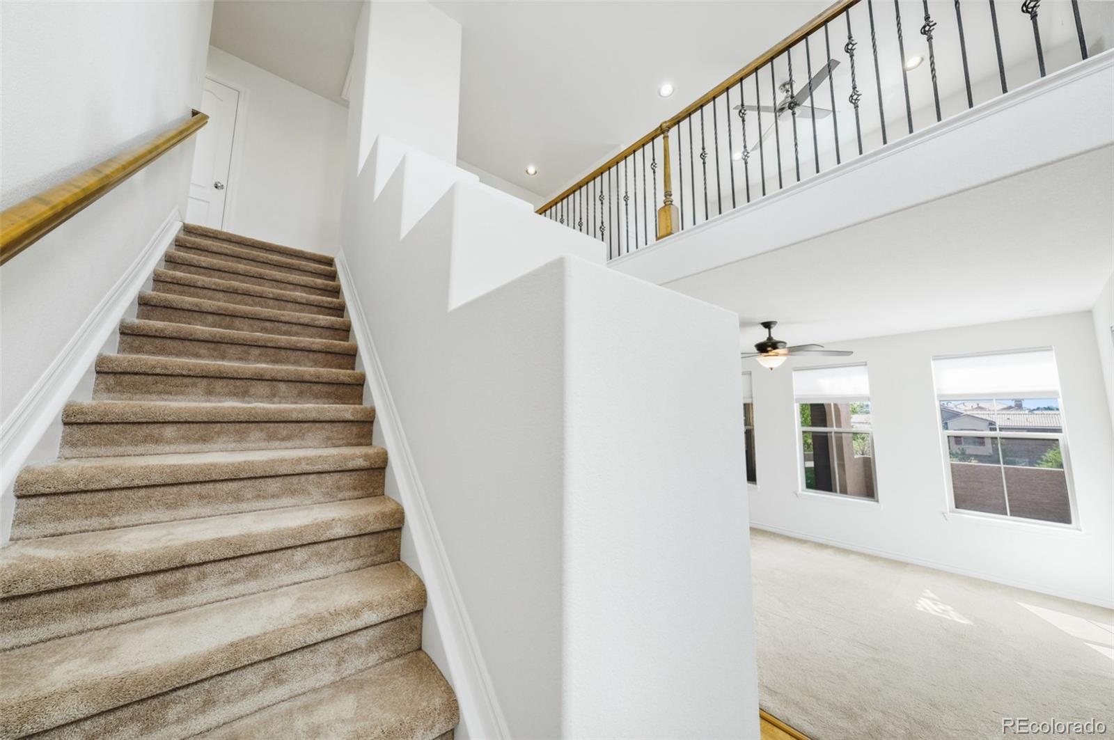 9550 Rosato Court Highlands Ranch, CO 80126 - Photo 16 of 27 a view of entryway and hall with wooden floor